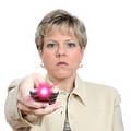 Beautiful Woman Aiming Remote with Light On Over White