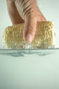 Hand and corn in water 2