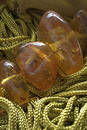 Green threads and amber