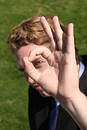 Eye through Okay Sign