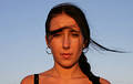 Young girl in the sunset light