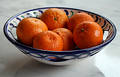 Oranges in  ceramic dish