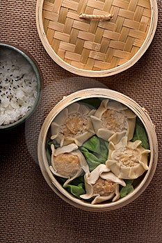 Stock Image - Dumplings and rice in baskets
