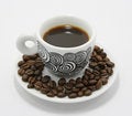 Cup of coffee with coffee beans free stock photo