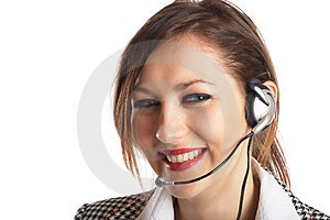 Krásný Zástupce Zákazníka s headsetem smát během telefonního rozhovoru.