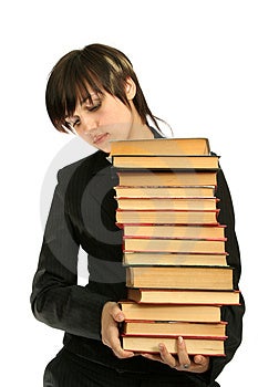 Das junge Mädchen mit Büchern, isoliert auf weiß.