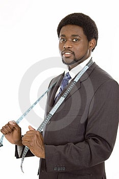 Questa è un'immagine di un uomo d'affari, che indossa il nastro di misurazione.