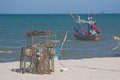 Lobster pot and fishing boat free stock photo